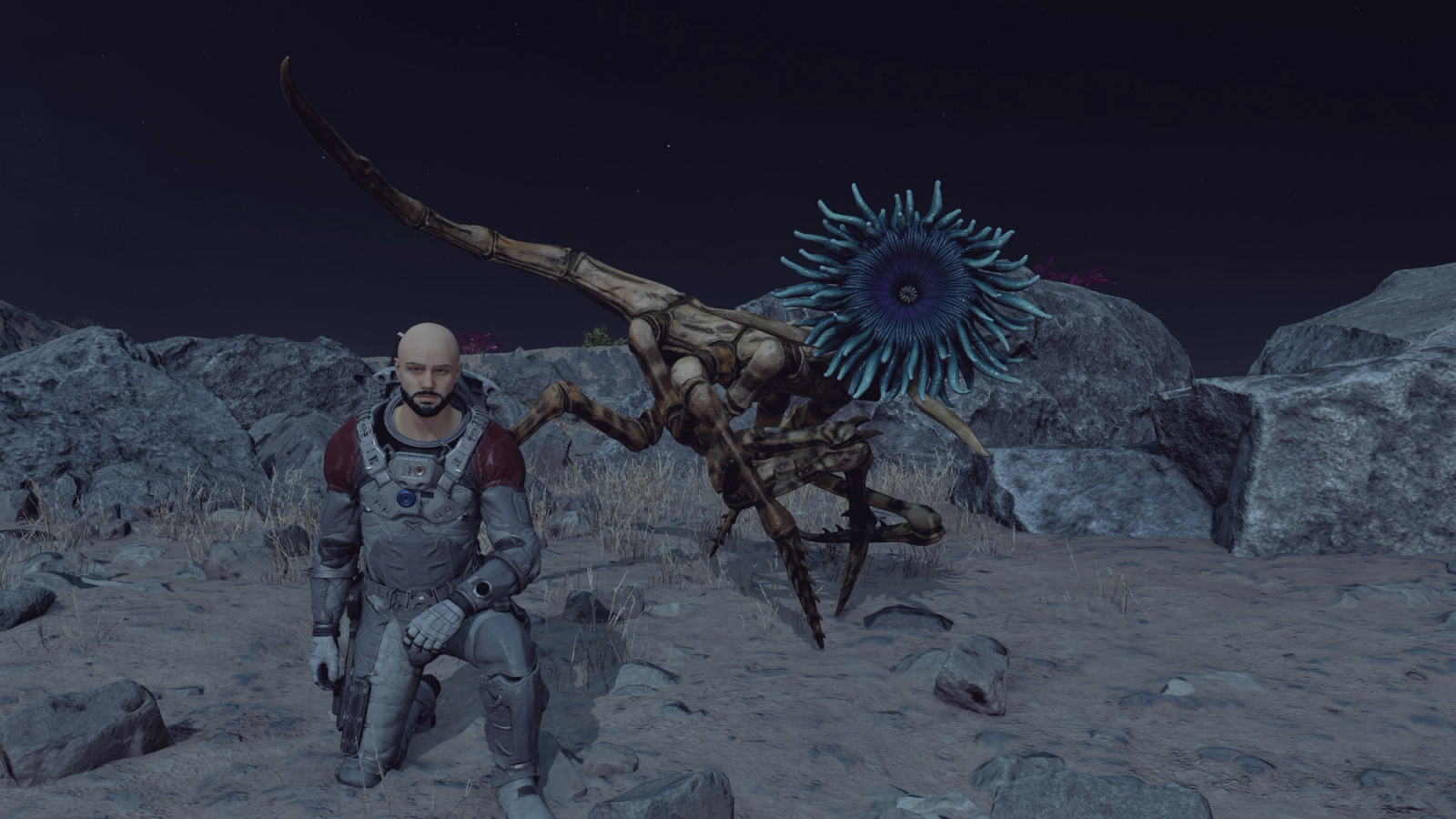 Player poses next to alien