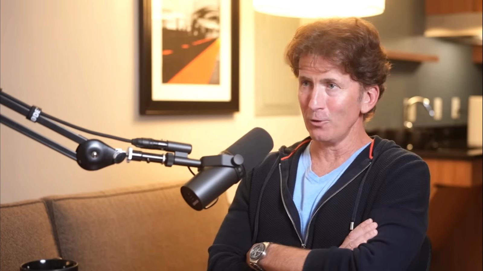 Todd Howard sits behind a microphone