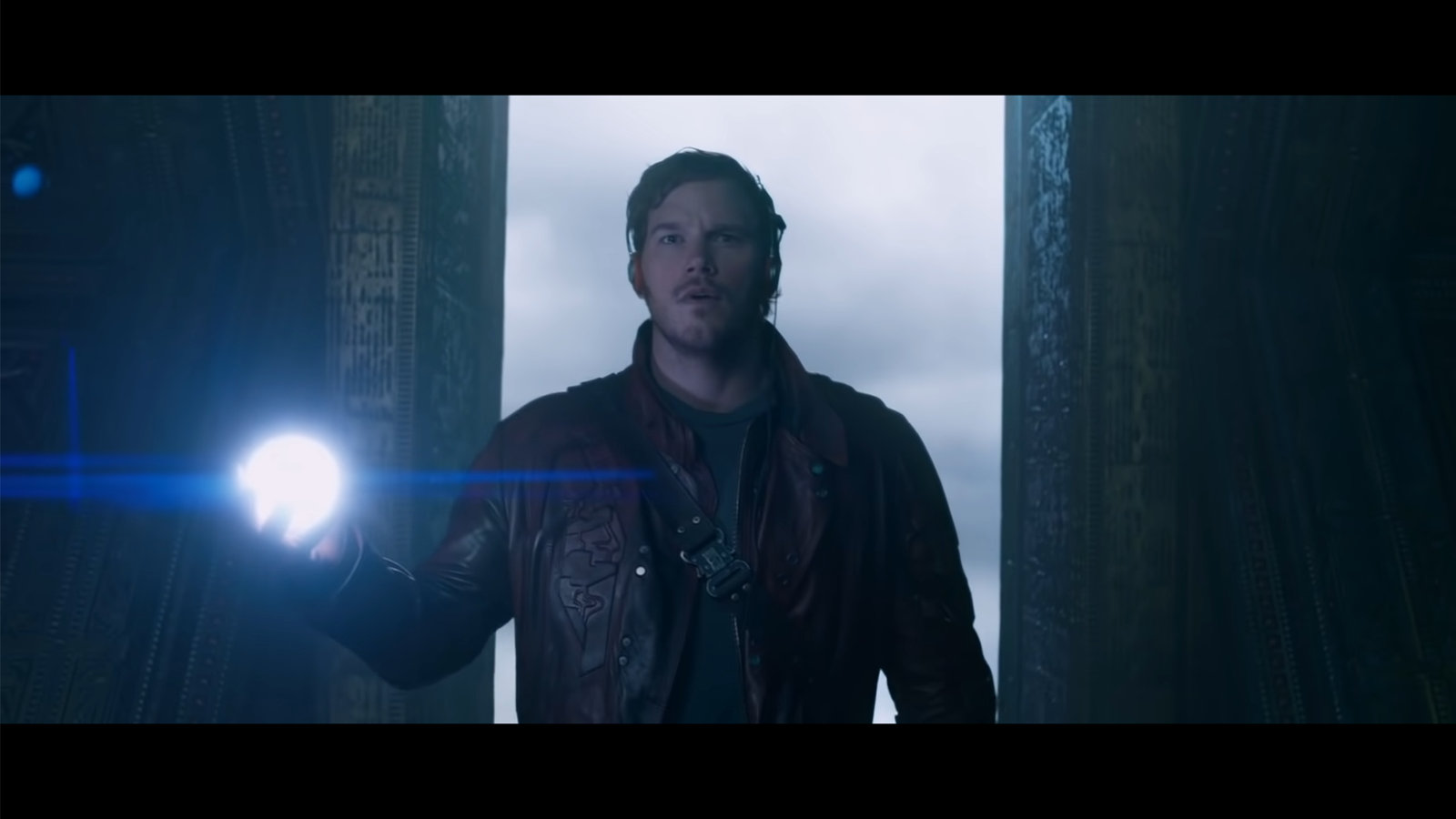 Starlord stands with a glowing orb